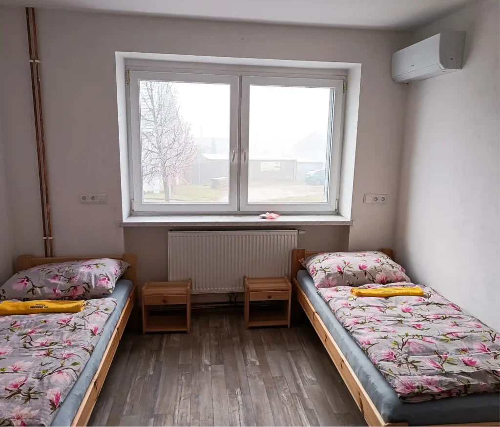 Postele ve dvoulůžkovém apartmánu